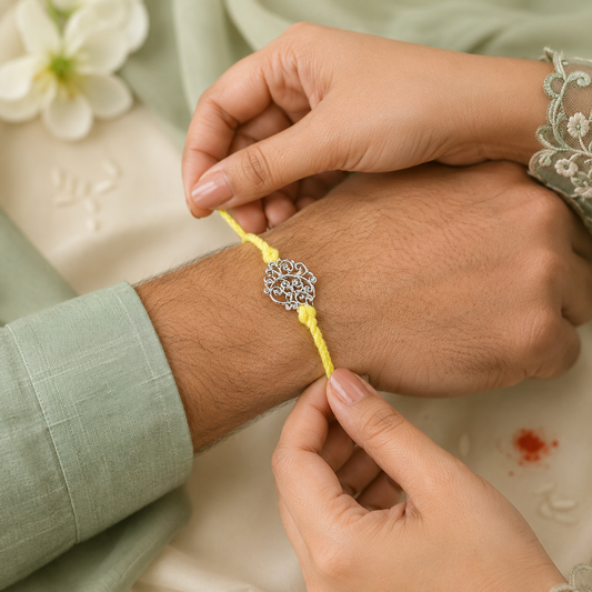Filigree Leaf Handcrafted 92.5 Silver Rakhi with Yellow Thread