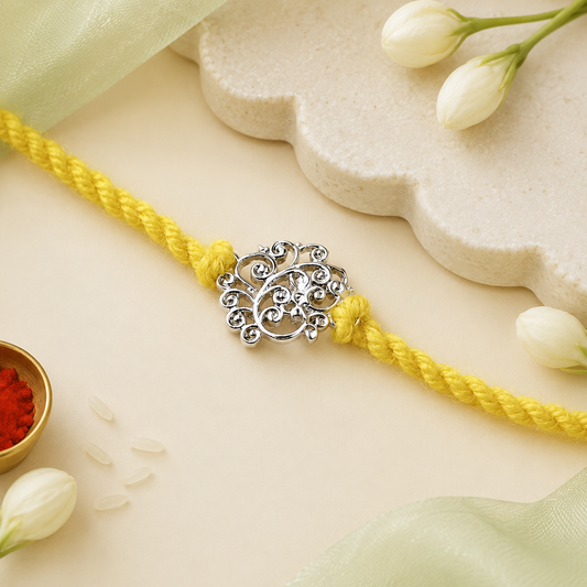 Filigree Leaf Handcrafted 92.5 Silver Rakhi with Yellow Thread
