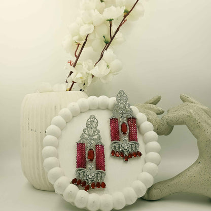 Silver-tone red beaded chandelier earrings with clear stones and teardrop drops