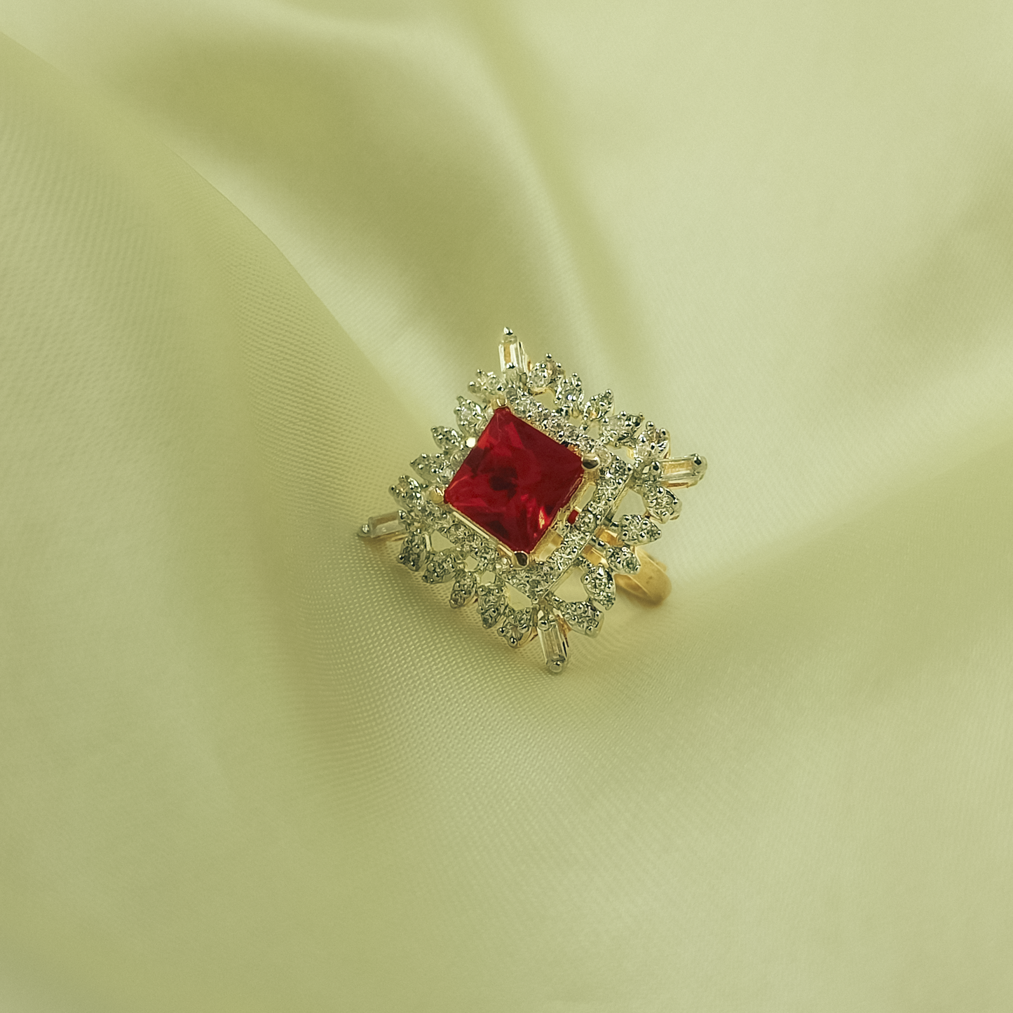 Square red cocktail ring with mixed clear halo and gold-tone band
