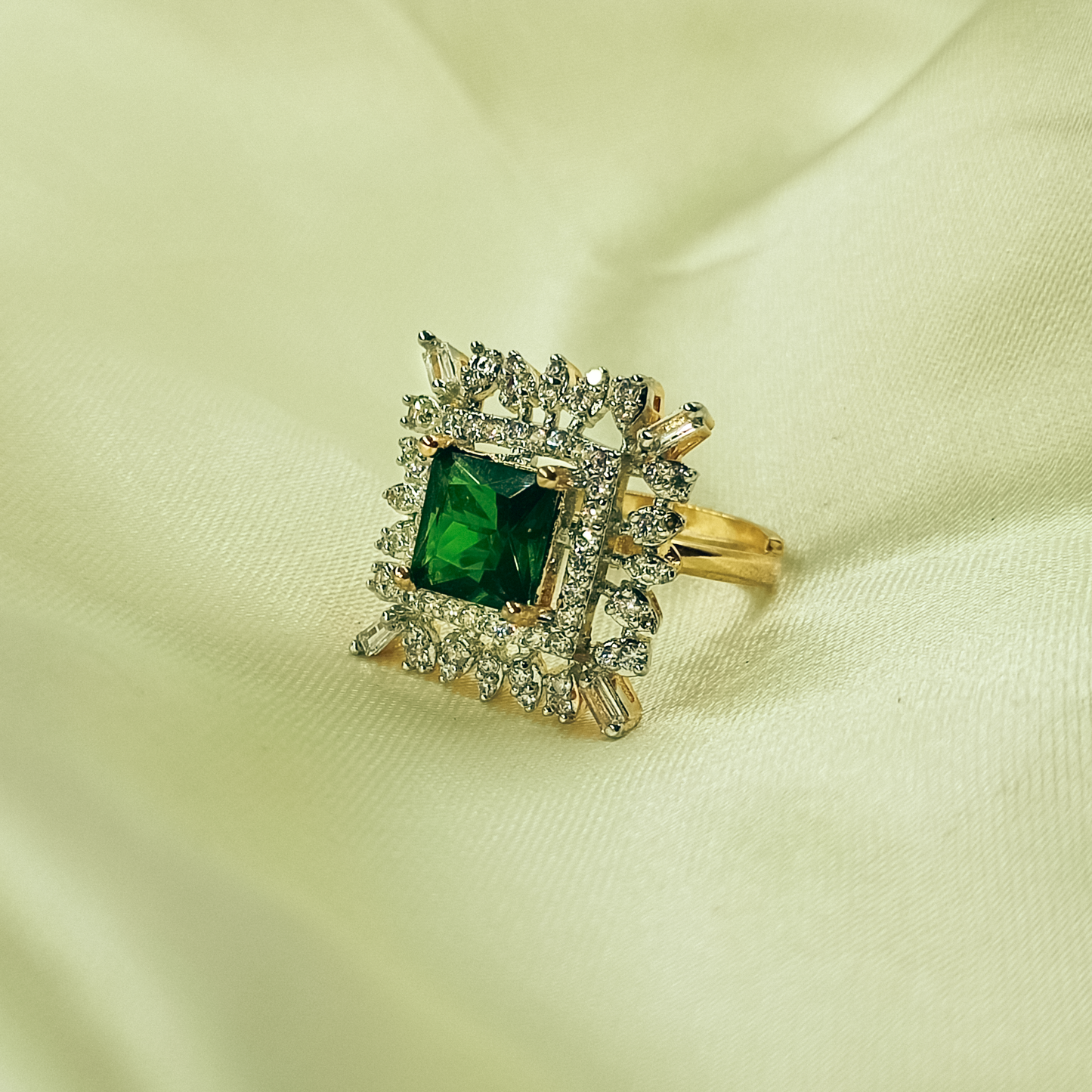 Square green cocktail ring with mixed clear halo and gold-tone band