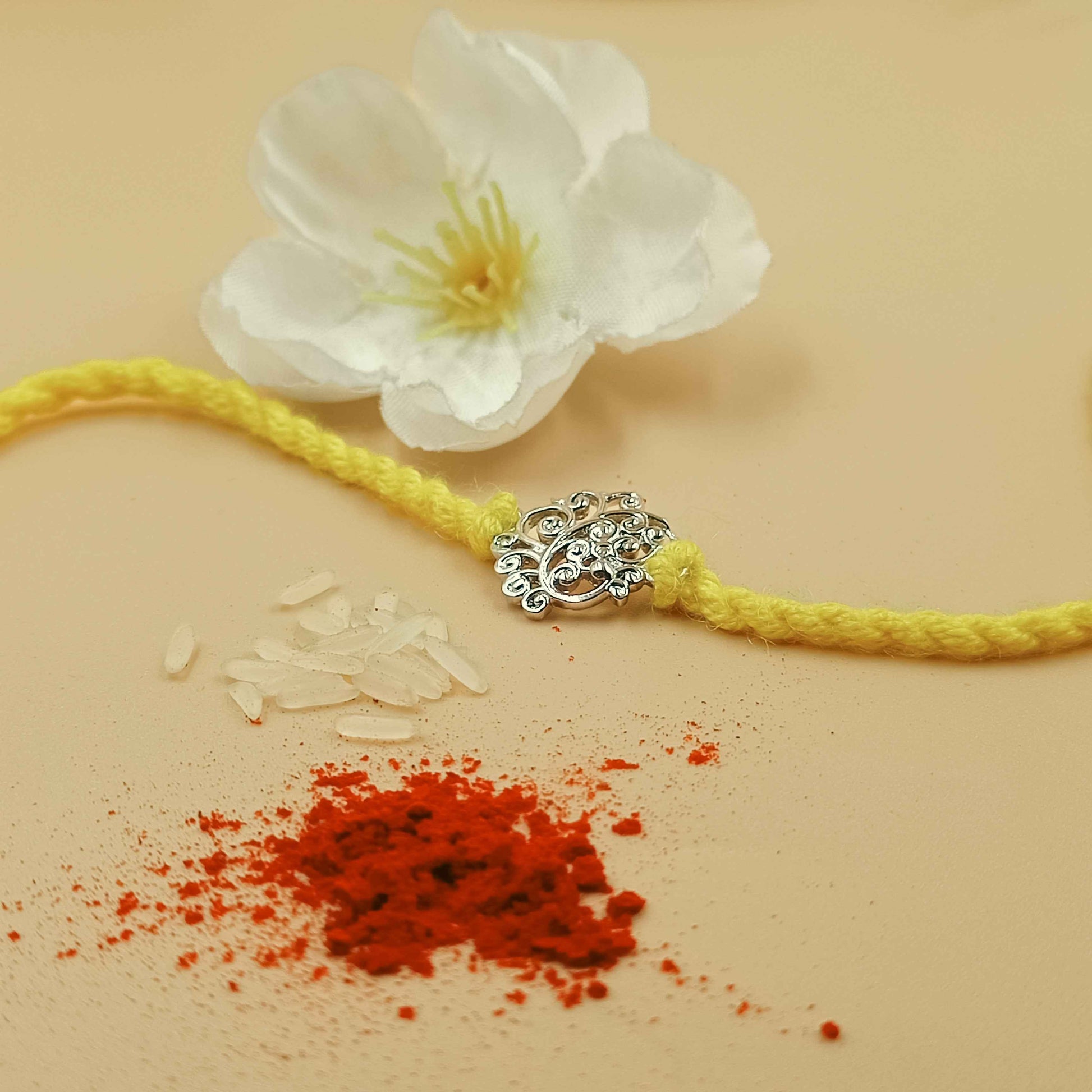 Filigree Leaf Handcrafted 92.5 Silver Rakhi with Yellow Thread