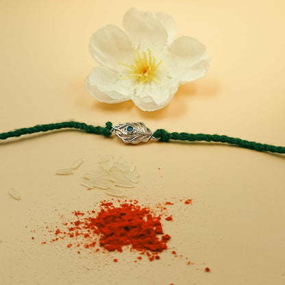 Peacock Feather Handcrafted 92.5 Silver Rakhi with Blue Stone